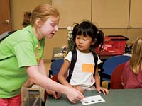 PHOTO: Teacher helping child