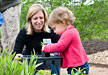 PHOTO: child planting at Going Green