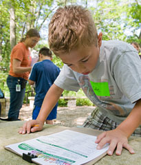 PHOTO: camper identifying plants in bloom