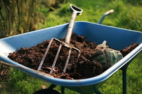 PHOTO: Use a wheelbarrow to mix new soil into your garden beds