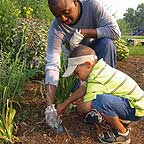 PHOTO: teacher helping plant