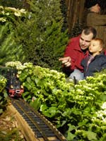 PHOTO: dad and child look at train