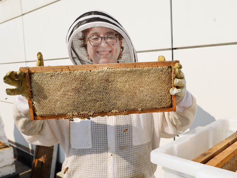 Iris Michael shows off one of the honey frames