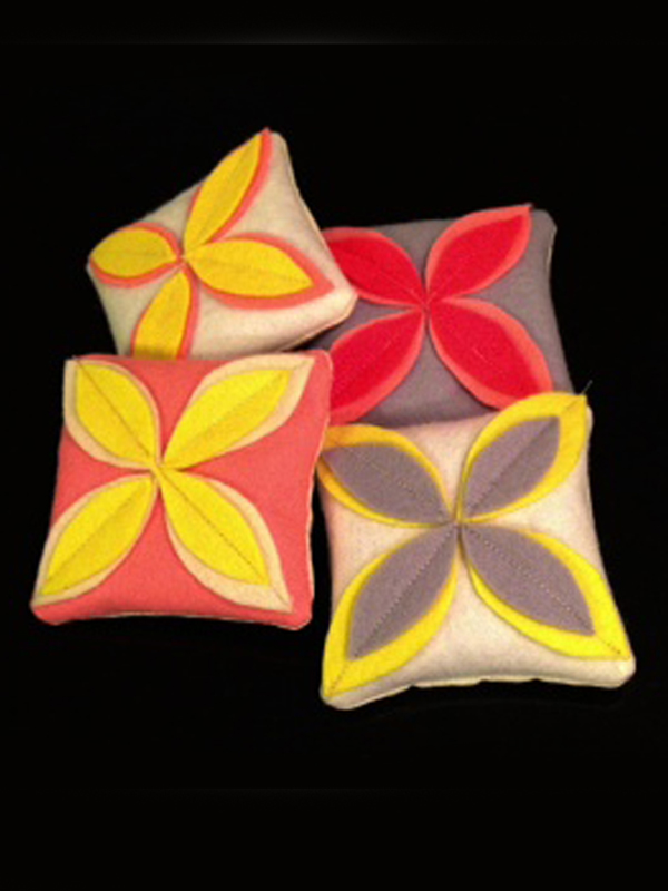 Wool felt and cotton sachets are filled with fragrant lavender.