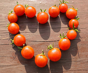 A heart made from cherry tomatoes